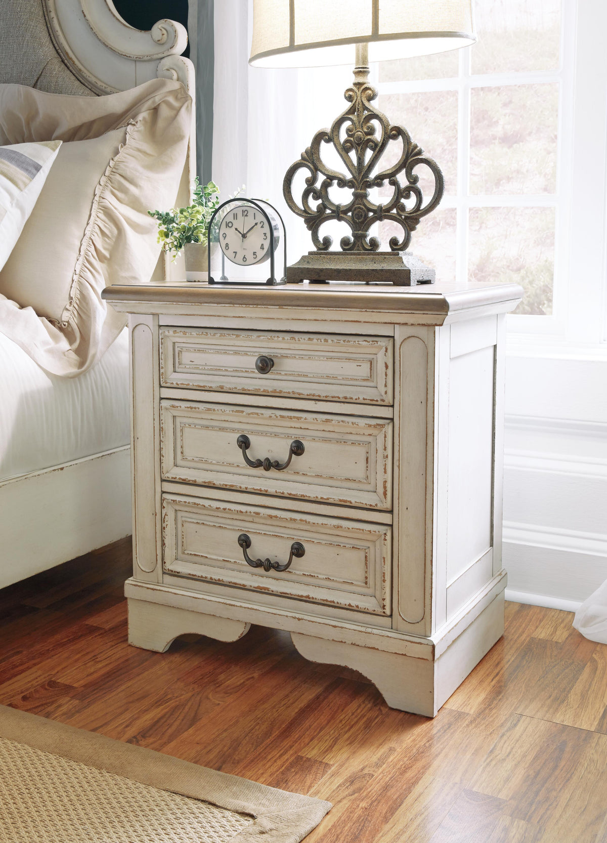 Realyn Queen Upholstered Storage Bed, Dresser and Nightstand