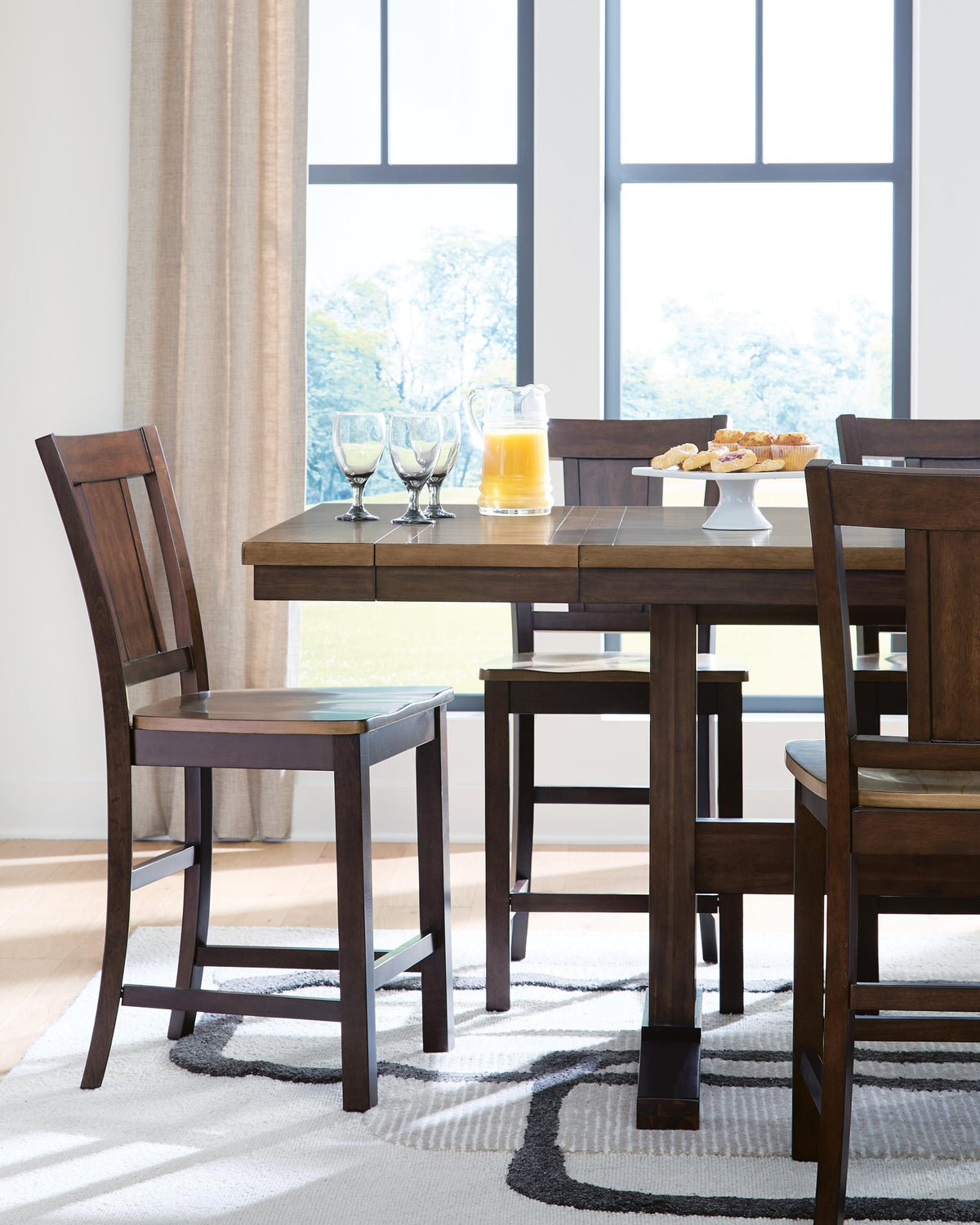 Rylandeen Counter Height Extension Dining Table and 8 Barstools